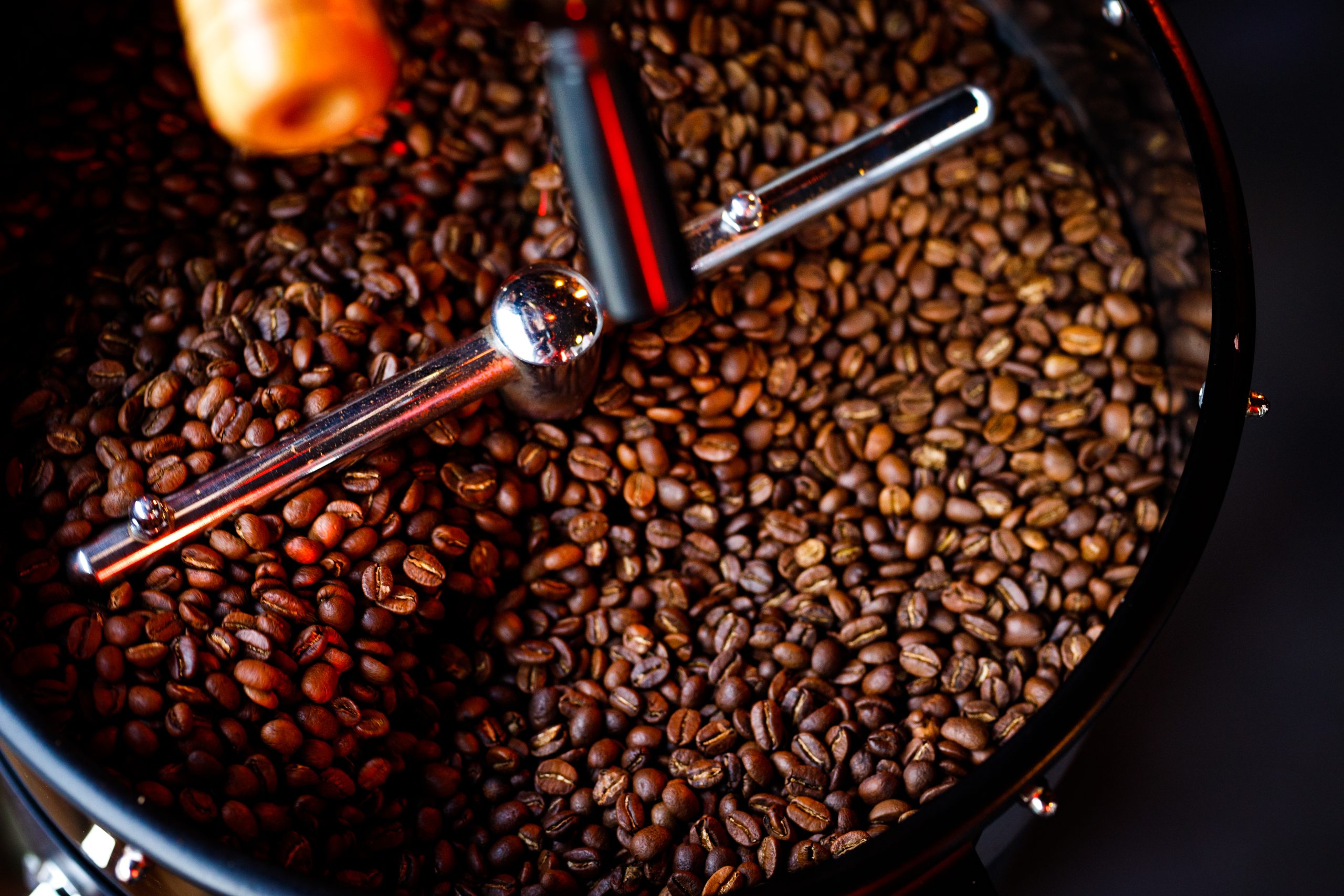 coffee beans in a coffee machine, in dark colors.